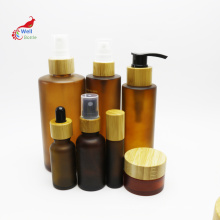 custom luxury bamboo cosmetic packaging set glass pump spray dropper roller bottle with bamboo cap BJ-241B